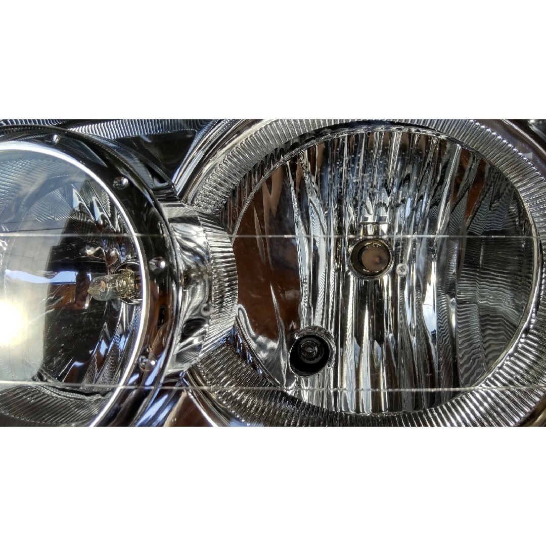 【超美品 レンズコーティング済み】テリオスキッド J131G ヘッドライト 左右 自動車/バイクの自動車(車種別パーツ)の商品写真