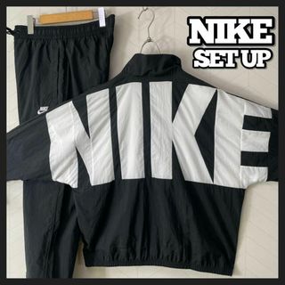 ナイキ(NIKE)の美品 NIKE ナイロン トラックジャケット パンツ セットアップ デカロゴ 黒(ナイロンジャケット)