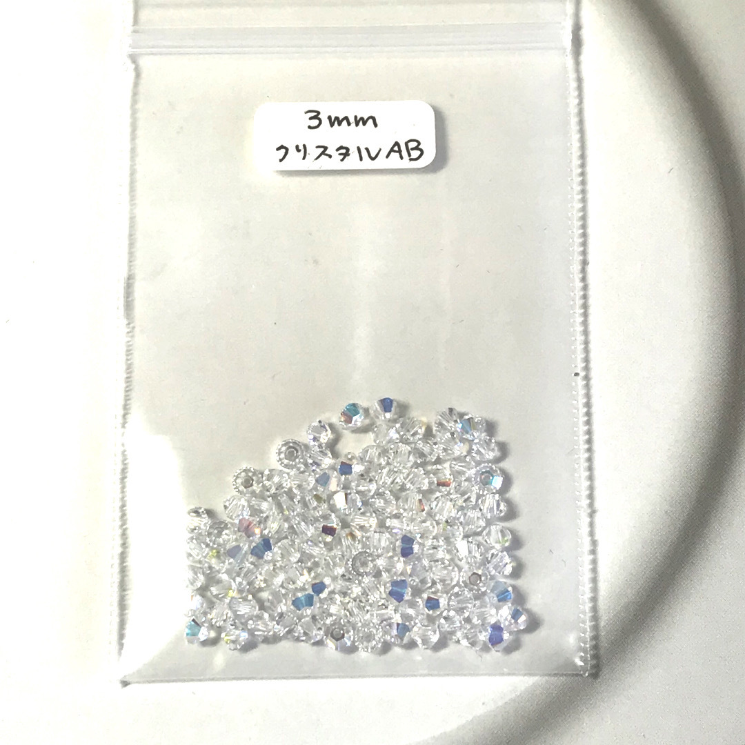 SWAROVSKI(スワロフスキー)のスワロフスキー#5328  3mm   クリスタルAB ハンドメイドの素材/材料(各種パーツ)の商品写真