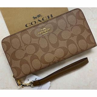 コーチ(COACH)の[新品未使用]✨COACH✨シグネチャー柄ラウンドファスナー長財布ストラップ付き(財布)