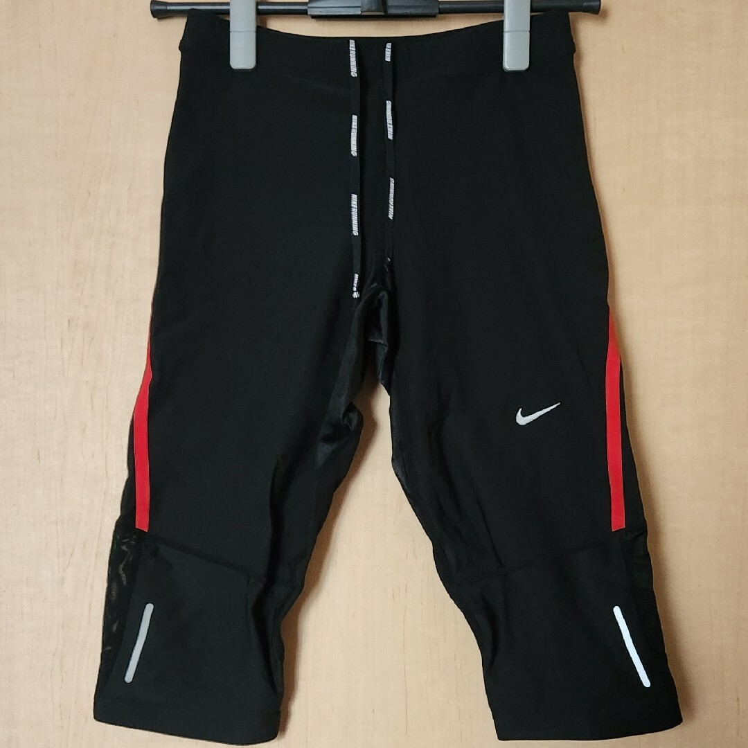 NIKE(ナイキ)のナイキ NIKE RUNNING テック カプリタイツ M 黒×赤 膝下丈 新品 スポーツ/アウトドアのランニング(ウェア)の商品写真