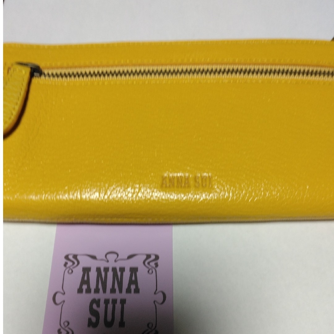 ANNA SUI(アナスイ)のANNA SUI　長財布　黄色　バタフライチャーム　可愛いです！ レディースのファッション小物(財布)の商品写真