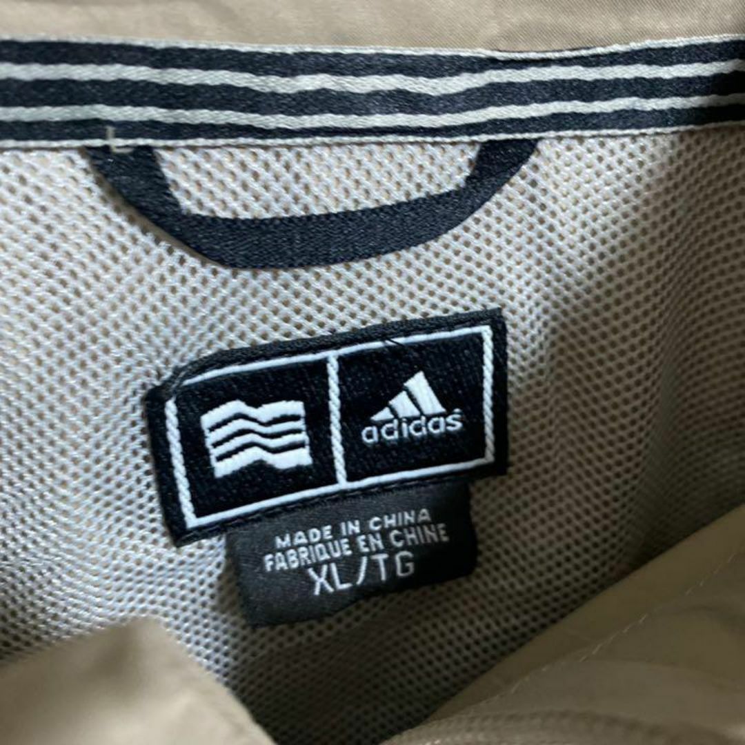 adidas(アディダス)のアディダス ナイロン ジャケット ハーフジップ 半袖 ベージュ ロゴ USA古着 メンズのジャケット/アウター(ナイロンジャケット)の商品写真