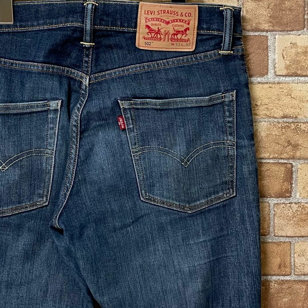 Levi's(リーバイス)のリーバイス　502　デニム　ジーンズ　ジーパン　革パッチ　ダメージ　31/32 メンズのパンツ(デニム/ジーンズ)の商品写真