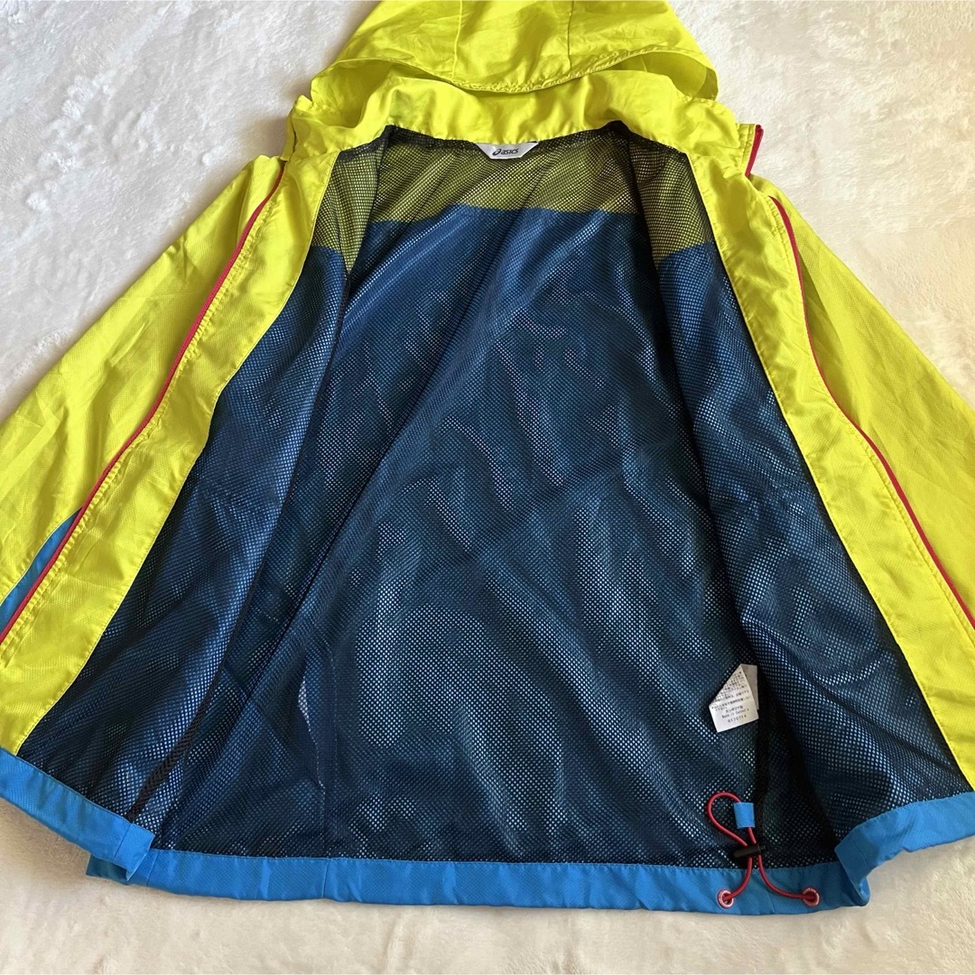 asics(アシックス)のasics アシックス ナイロンジャンパー 黄色×水色 防寒具 ランニングウェア レディースのジャケット/アウター(ナイロンジャケット)の商品写真