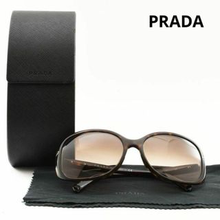 プラダ(PRADA)のプラダ　サングラス　SPR 08O　ブラウン系　ケース付き　57◻︎17(サングラス/メガネ)