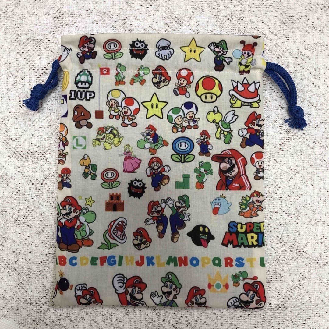 ハンドメイド🌟巾着袋🌟マリオ ハンドメイドのキッズ/ベビー(外出用品)の商品写真