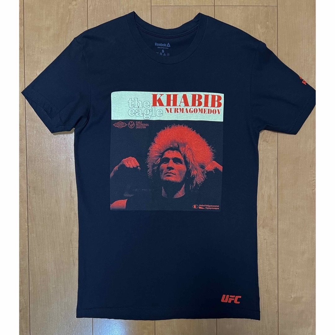 Reebok(リーボック)の未使用品ハビブ・ヌルマゴドメフUFC Eagle Retro PhotoTシャツ メンズのトップス(Tシャツ/カットソー(半袖/袖なし))の商品写真