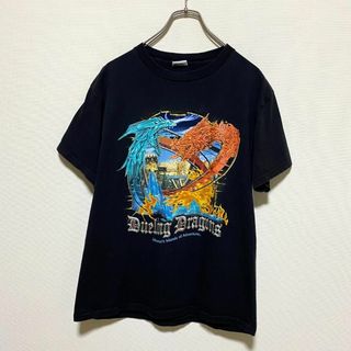 ユニバーサルエンターテインメント(UNIVERSAL ENTERTAINMENT)のアメリカ古着　デュエリングドラゴンズ　ユニバーサルスタジオ　半袖Tシャツ　I60(Tシャツ/カットソー(半袖/袖なし))