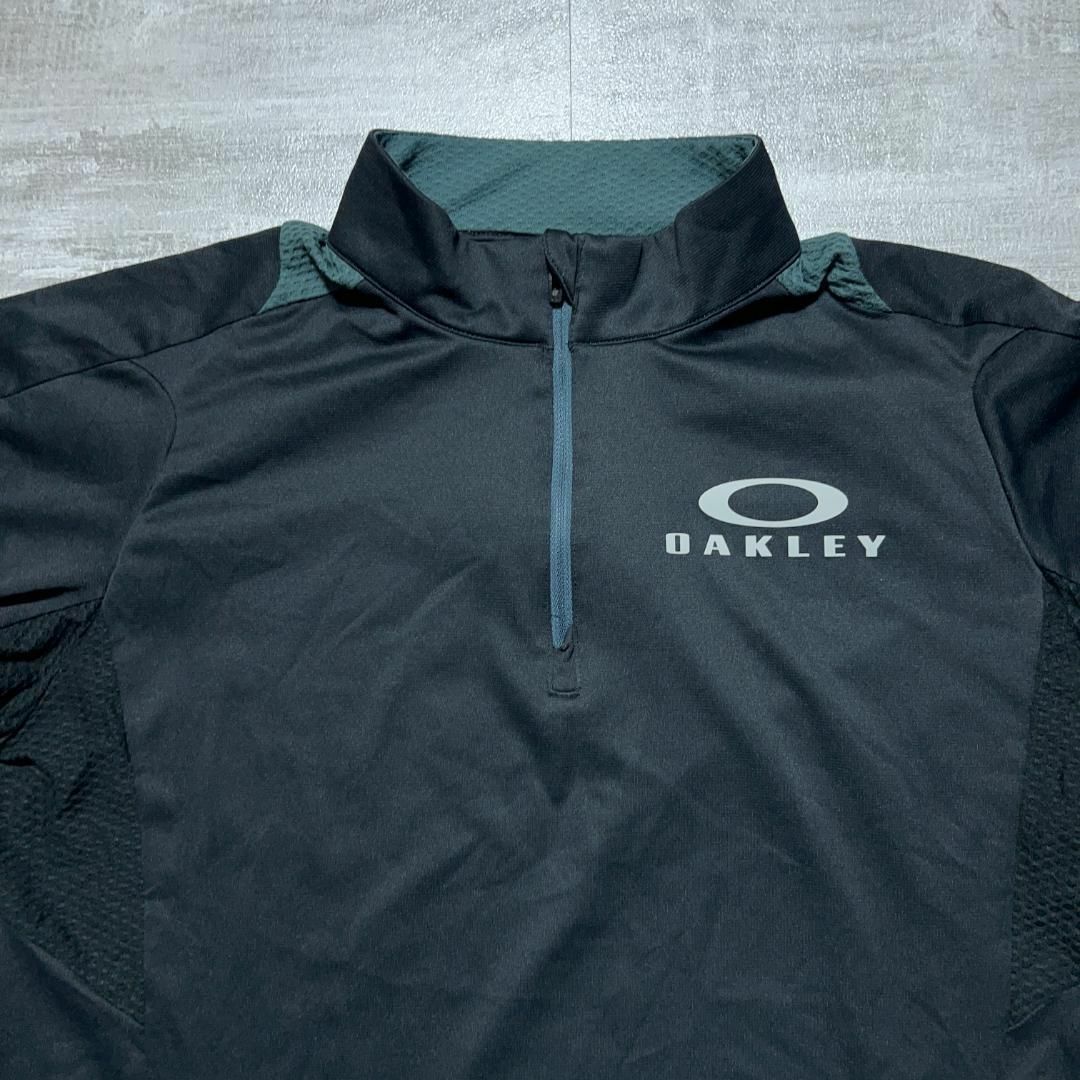 Oakley(オークリー)の美品 OAKLEY オークリー ハーフジップシャツ 黒 ブラック ゴルフウェア スポーツ/アウトドアのゴルフ(ウエア)の商品写真