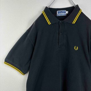 フレッドペリー(FRED PERRY)の人気　フレッドペリー　ポロシャツ　半袖　イングランド製　S 黒　黄　ビンテージ(ポロシャツ)