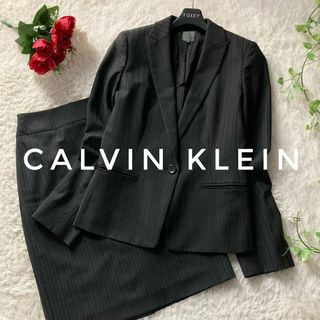 カルバンクライン(Calvin Klein)のカルバンクライン　スカートスーツ　テーラードジャケット　背抜き　ストライプ　黒(スーツ)