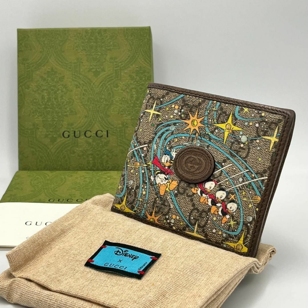 Gucci(グッチ)のGUCCI ディズニーコラボ ドナルドダック 折り財布 GGスプリーム ブラウン レディースのファッション小物(財布)の商品写真