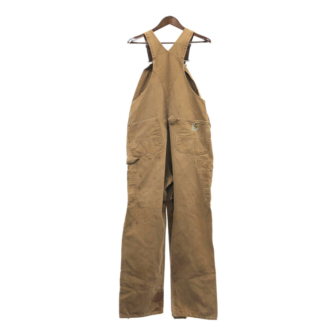 carhartt(カーハート)の80年代 USA製 Carhartt カーハート ダブルニー オーバーオール ワーク ダック地 ベージュ (メンズ XL相当) 中古 古着 Q3764 メンズのパンツ(サロペット/オーバーオール)の商品写真