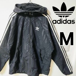 オリジナルス(Originals（adidas）)のアディダス 黒 モノグラム 総柄 ナイロンジャケット パーカー メンズM(ナイロンジャケット)