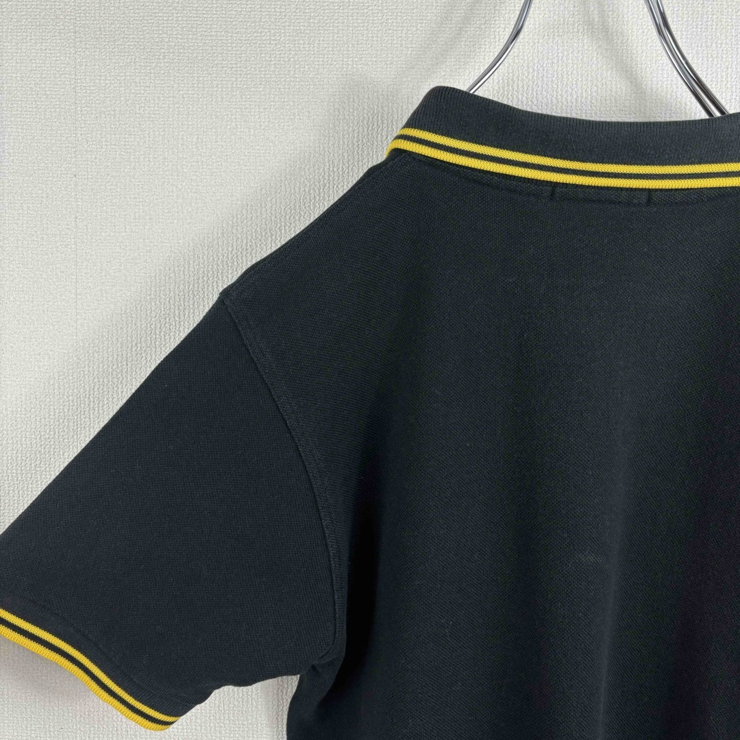 FRED PERRY(フレッドペリー)の大人気　フレッドペリー　ポロシャツ　ヴィンテージ　半袖　黒　黄色　XS 古着 メンズのトップス(ポロシャツ)の商品写真