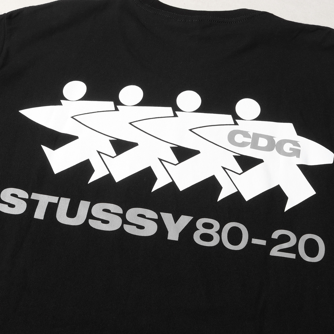 STUSSY(ステューシー)の美品 STUSSY ステューシー Tシャツ サイズ:L 20AW CDG 40周年記念 サーフマン クルーネック 半袖Tシャツ ブラック 黒 トップス カットソー【メンズ】【中古】 メンズのトップス(Tシャツ/カットソー(半袖/袖なし))の商品写真