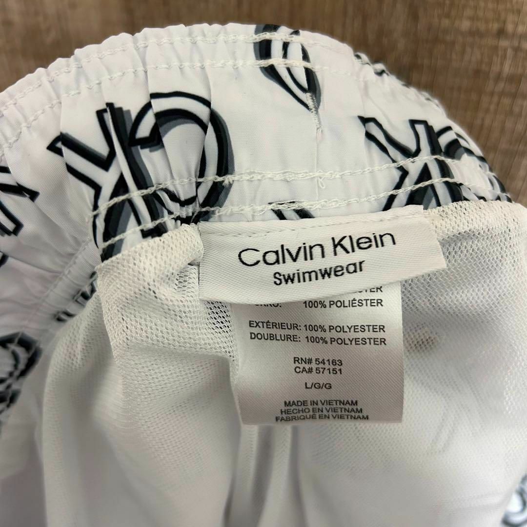 Calvin Klein(カルバンクライン)の【新品】Calvin Klein カルバンクライン　水着　白　CKロゴ総柄　L メンズの水着/浴衣(水着)の商品写真