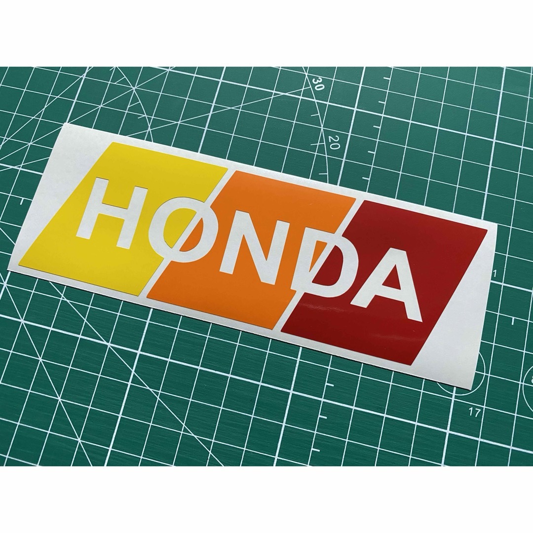 3色HONDAカッティングステッカー イエロー オレンジ 赤 本田 ホンダ 自動車/バイクの自動車(車外アクセサリ)の商品写真