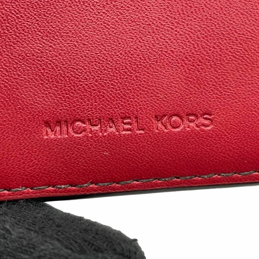 Michael Kors(マイケルコース)のMICHEL KORS マイケルコース　w2 黒　MK柄　総柄　二つ折り　財布 レディースのトップス(Tシャツ(半袖/袖なし))の商品写真