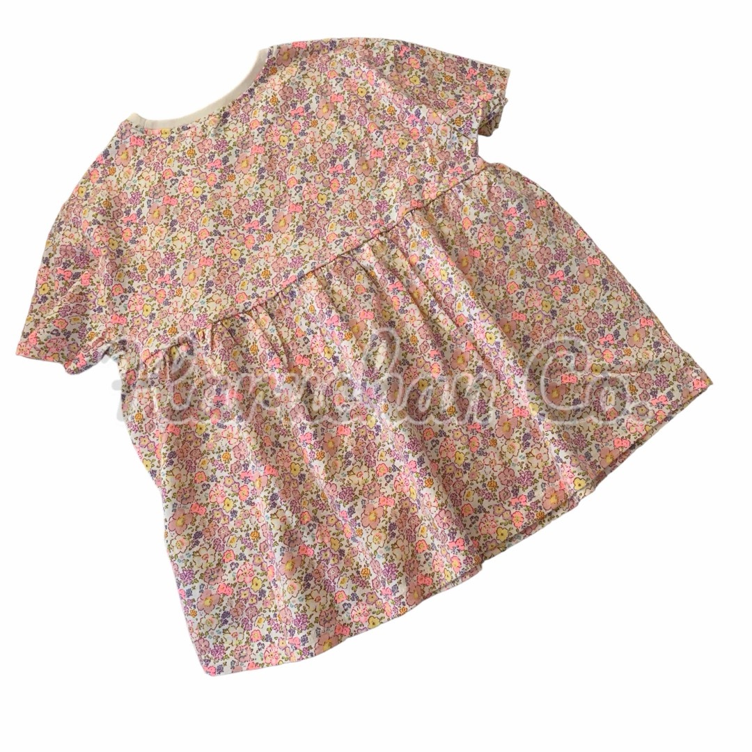 NEXT(ネクスト)の●未使用●4-5才　ピンク花柄　フレアトップス キッズ/ベビー/マタニティのキッズ服女の子用(90cm~)(Tシャツ/カットソー)の商品写真