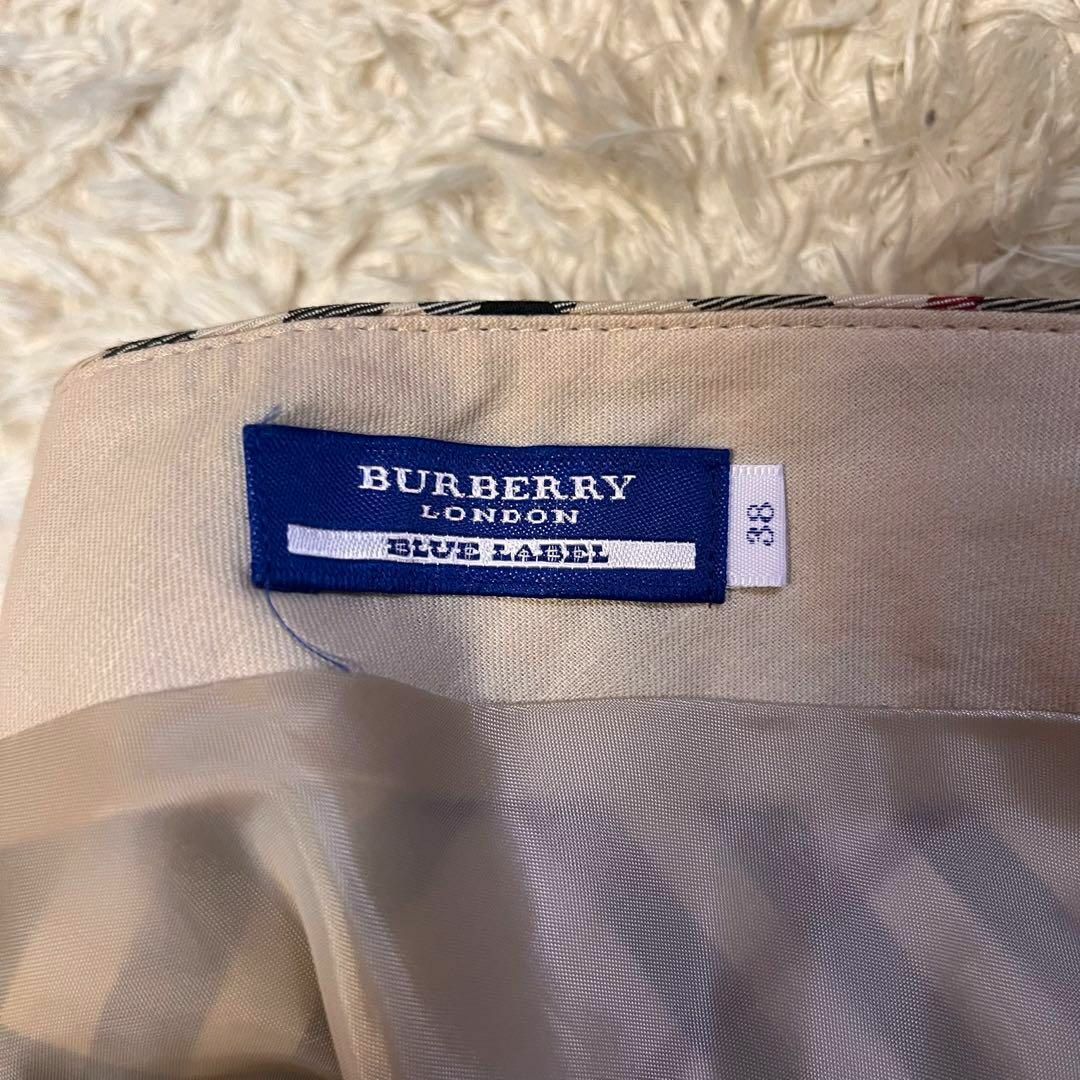 BURBERRY BLUE LABEL(バーバリーブルーレーベル)のベルト付き【バーバリーブルーレーベル】ノバチェックフレアスカート 38ホース刺繍 レディースのスカート(ひざ丈スカート)の商品写真