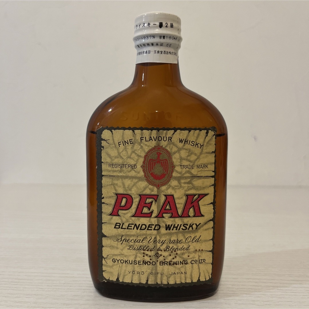 玉泉堂酒造(ギョクセンドウシュゾウ)のPEAK ピークウイスキー　180ml 1980年代流通品　古酒　ベビーボトル 食品/飲料/酒の酒(ウイスキー)の商品写真