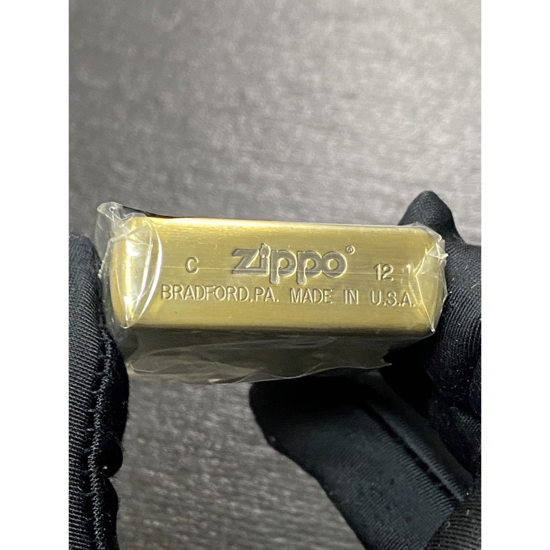 zippo パイレーツワールド 限定品 ゴールド 両面デザイン 2012年製 メンズのメンズ その他(その他)の商品写真