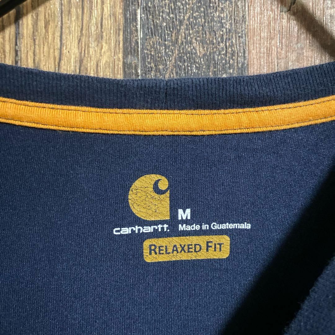 carhartt(カーハート)のカーハート Tシャツ ロンT ロゴ ワッペン ネイビー Mサイズ 紺色 US古着 メンズのトップス(Tシャツ/カットソー(七分/長袖))の商品写真