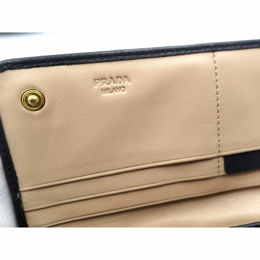 訳アリ】プラダ PRADA 二つ折り長財布 1M1132 ブラック 訳アリ】プラダ PRADA 二つ折り長財布 1M1132 ブラック