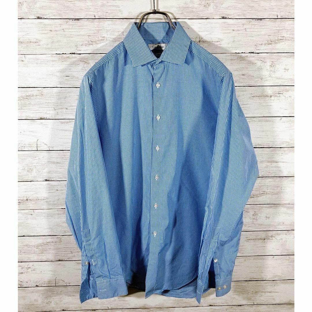 Calvin Klein(カルバンクライン)のＣＫカルバンクライン　青ブルーギンガムチェック　サイズＭ　長袖シャツ　メンズ古着 メンズのトップス(シャツ)の商品写真