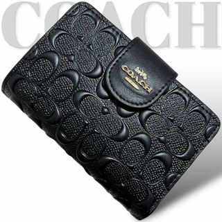 コーチ(COACH)の美品　コーチ　折り財布　エンボス　レザー　PVC 黒　ブラック　ロゴ金具(財布)