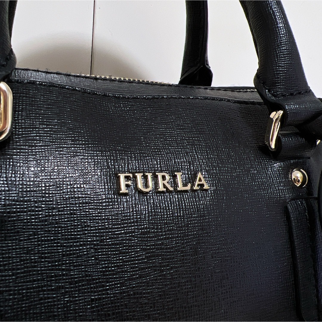 Furla(フルラ)の☆超美品☆送料無料☆FURLAフルラチャーム付きレザーハンドバッグ☆ブラック☆ レディースのバッグ(ショルダーバッグ)の商品写真