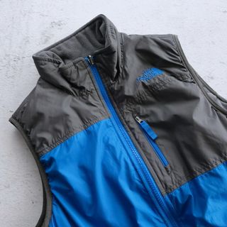 ザノースフェイス(THE NORTH FACE)のL(14/16)サイズ/ザノースフェイス リバーシブル ベスト ブルー×グレー系(ジャケット/上着)