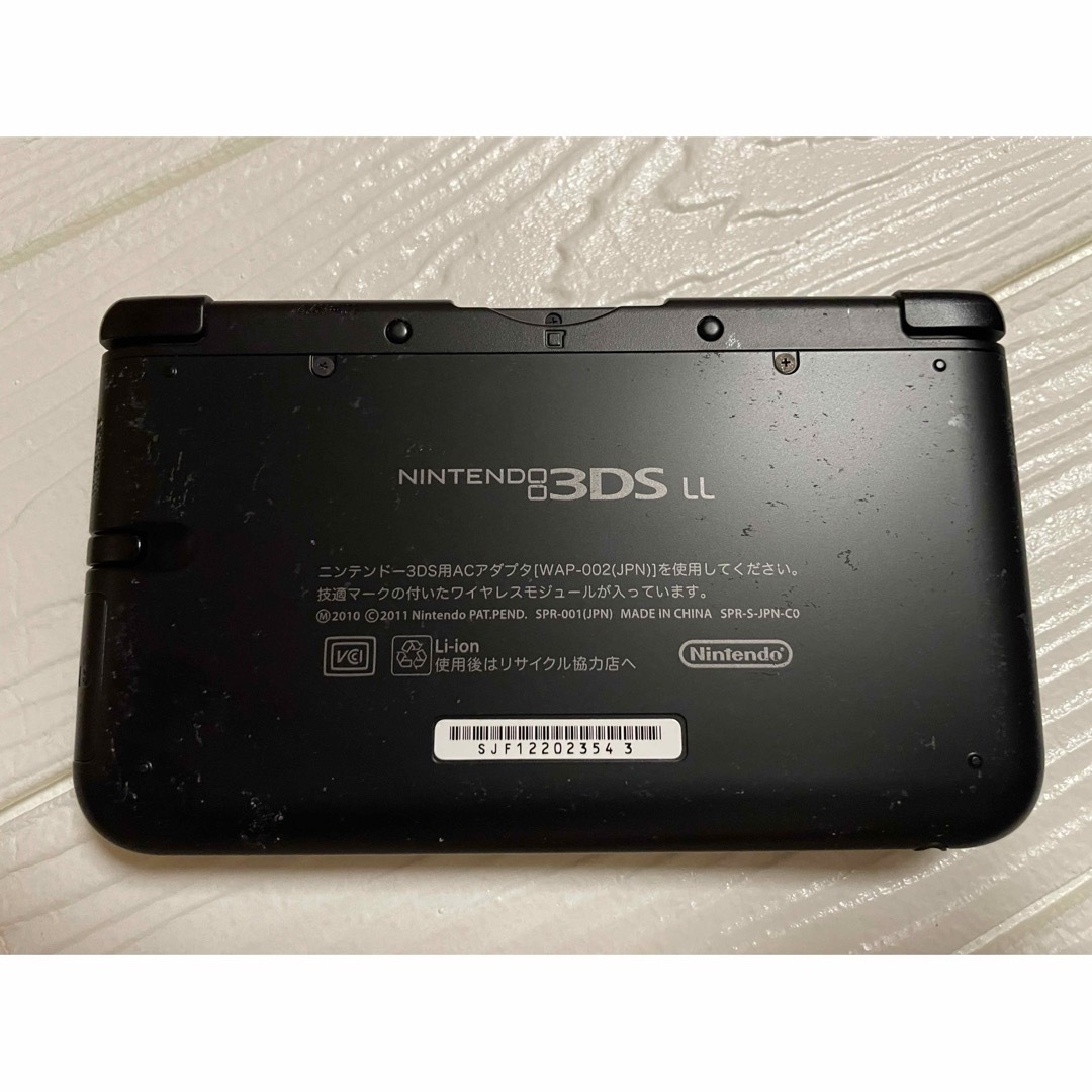 ニンテンドー3DS(ニンテンドー3DS)のGW限定値下げ！任天堂3DSLL ブラック中古品　付属品、マリオ系ソフト４本付き エンタメ/ホビーのゲームソフト/ゲーム機本体(携帯用ゲーム機本体)の商品写真