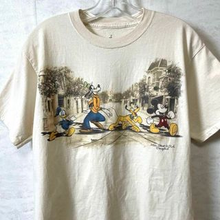 ディズニー(Disney)のディズニー　ミッキーマウス　ドナルド　プルート　サイズＭ　ベージュ　メンズ　古着(Tシャツ/カットソー(半袖/袖なし))