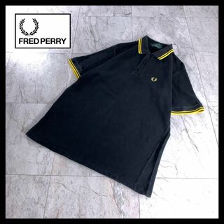 フレッドペリー(FRED PERRY)の古着 FRED PERRY ポロシャツ 半袖 M12 黒 黄色 40 英国製(ポロシャツ)