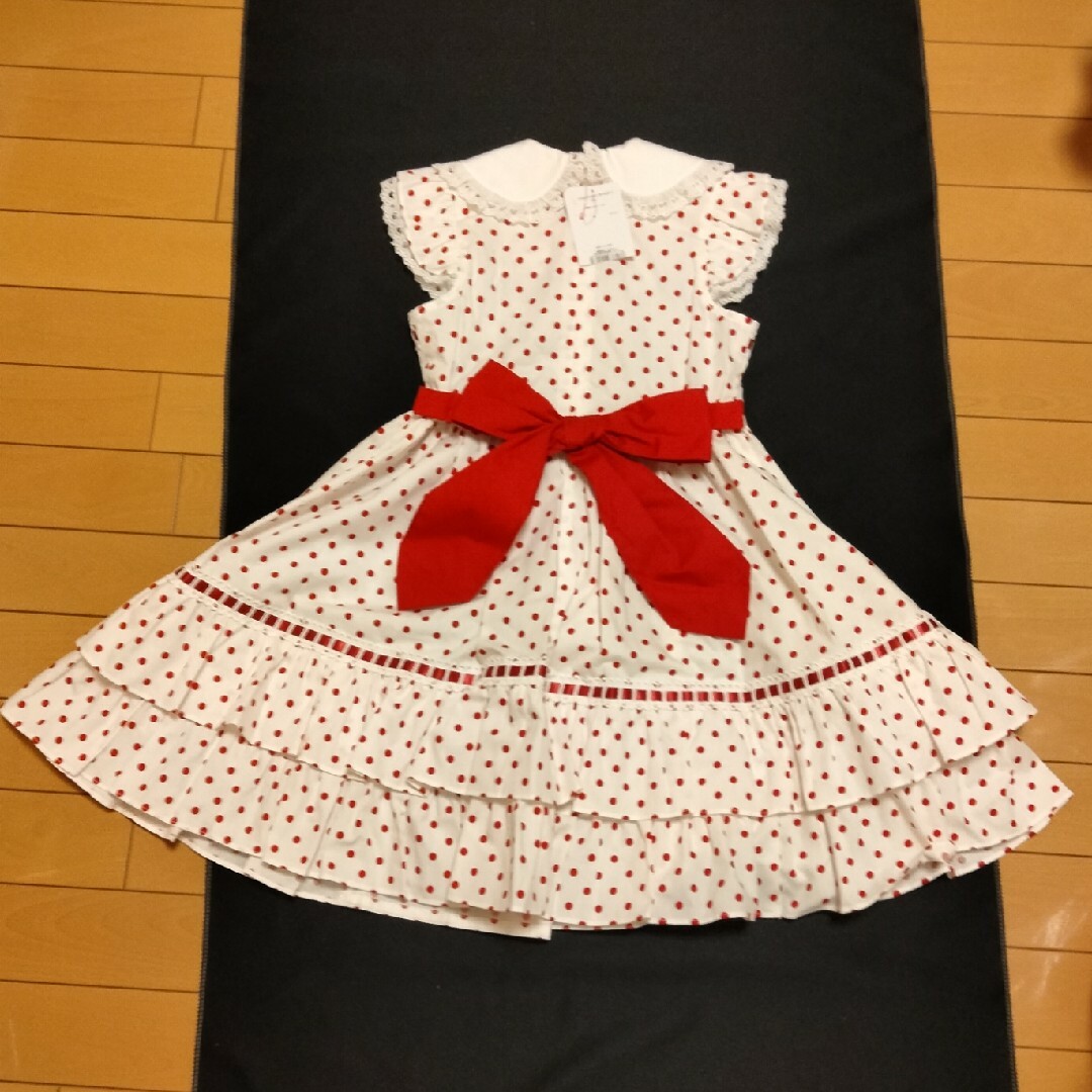 Shirley Temple(シャーリーテンプル)の新品シャーリーテンプル130 阪急限定🎀はしごリボンドットワンピース キッズ/ベビー/マタニティのキッズ服女の子用(90cm~)(ワンピース)の商品写真