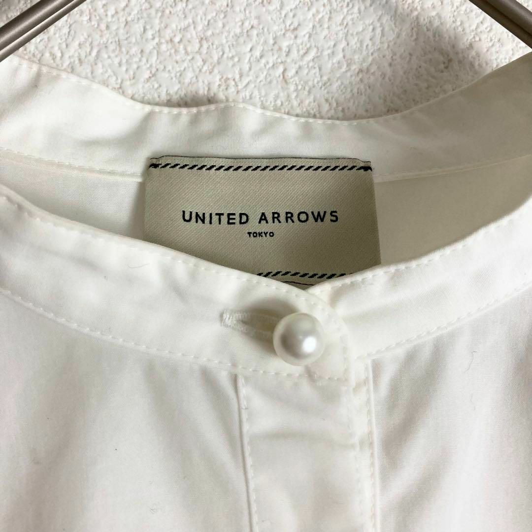 UNITED ARROWS(ユナイテッドアローズ)の401＊ユナイテッドアローズ SPONGY パールモチーフ ペプラム ブラウス レディースのトップス(シャツ/ブラウス(長袖/七分))の商品写真