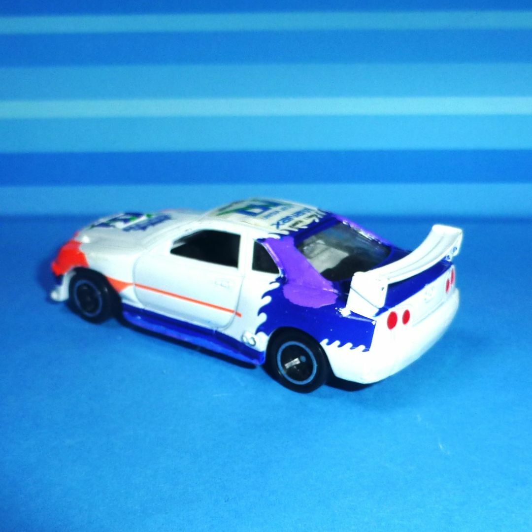 Takara Tomy(タカラトミー)のトミカ No.40 日産スカイライン レーシング(R34) エンタメ/ホビーのおもちゃ/ぬいぐるみ(ミニカー)の商品写真