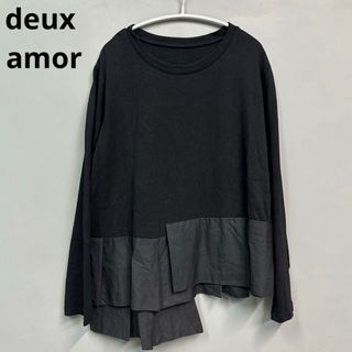 エムドゥー(M.deux)のdeux amor ドゥーザムール　アシメぺプラムカットソー　黒　Ｍ-Ｌサイズ(Tシャツ(長袖/七分))