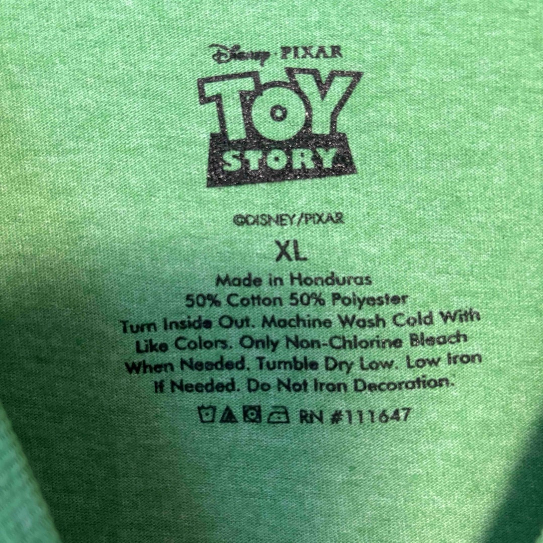 Disney(ディズニー)の【希少デザイン】ディズニー　トイストーリー　レックス　Tシャツ　XLサイズ メンズのトップス(Tシャツ/カットソー(半袖/袖なし))の商品写真