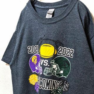 ギルダン トロージャンズvsウォーホース ロゴ Tシャツ グレー 灰色 古着(Tシャツ/カットソー(半袖/袖なし))