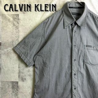 カルバンクライン(Calvin Klein)の美品 カルバンクライン ストライプシャツ 半袖 ワンポイントロゴ モノトーン L(シャツ)