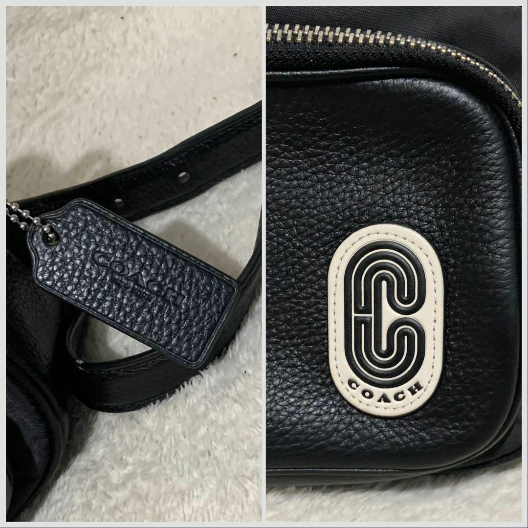 COACH(コーチ)の【極美品】コーチ カメラバッグ ショルダー ロゴワッペン 91065 黒　花柄 レディースのバッグ(ショルダーバッグ)の商品写真