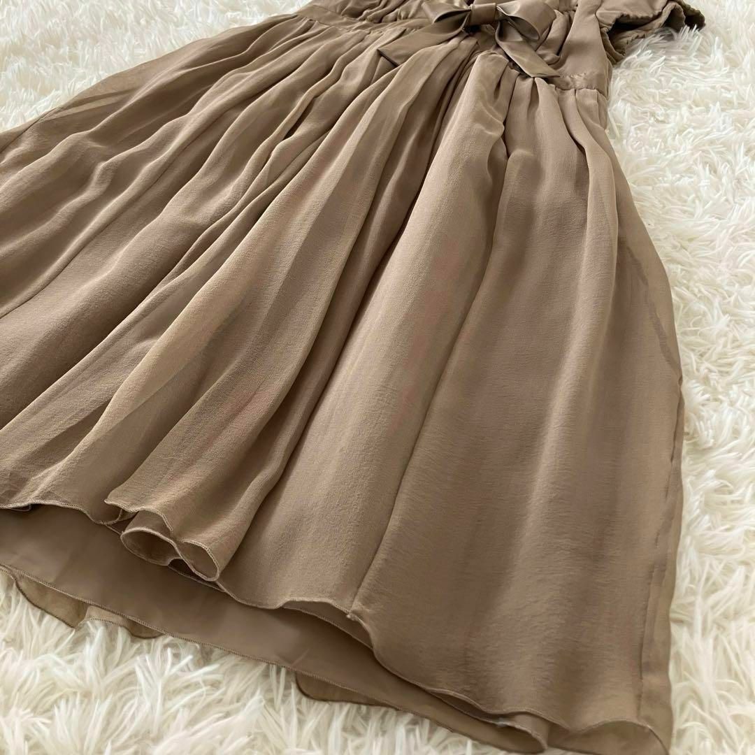 MOSCHINO(モスキーノ)のMOSCHINO シルクプリーツフレアワンピース ドレス L ベージュ リボン レディースのワンピース(ひざ丈ワンピース)の商品写真