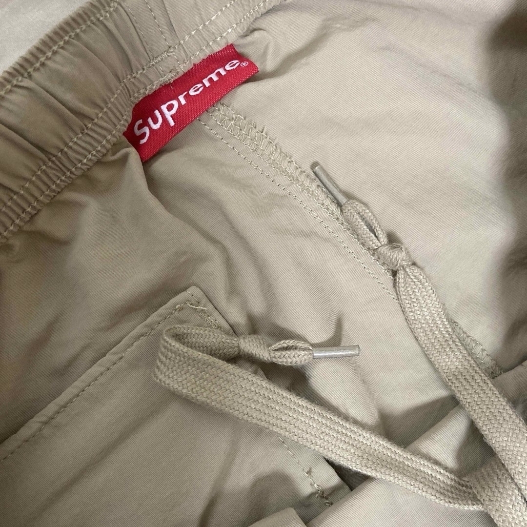 Supreme(シュプリーム)のSUPREME WARM UP PANT pants ナイロンパンツ メンズのパンツ(その他)の商品写真