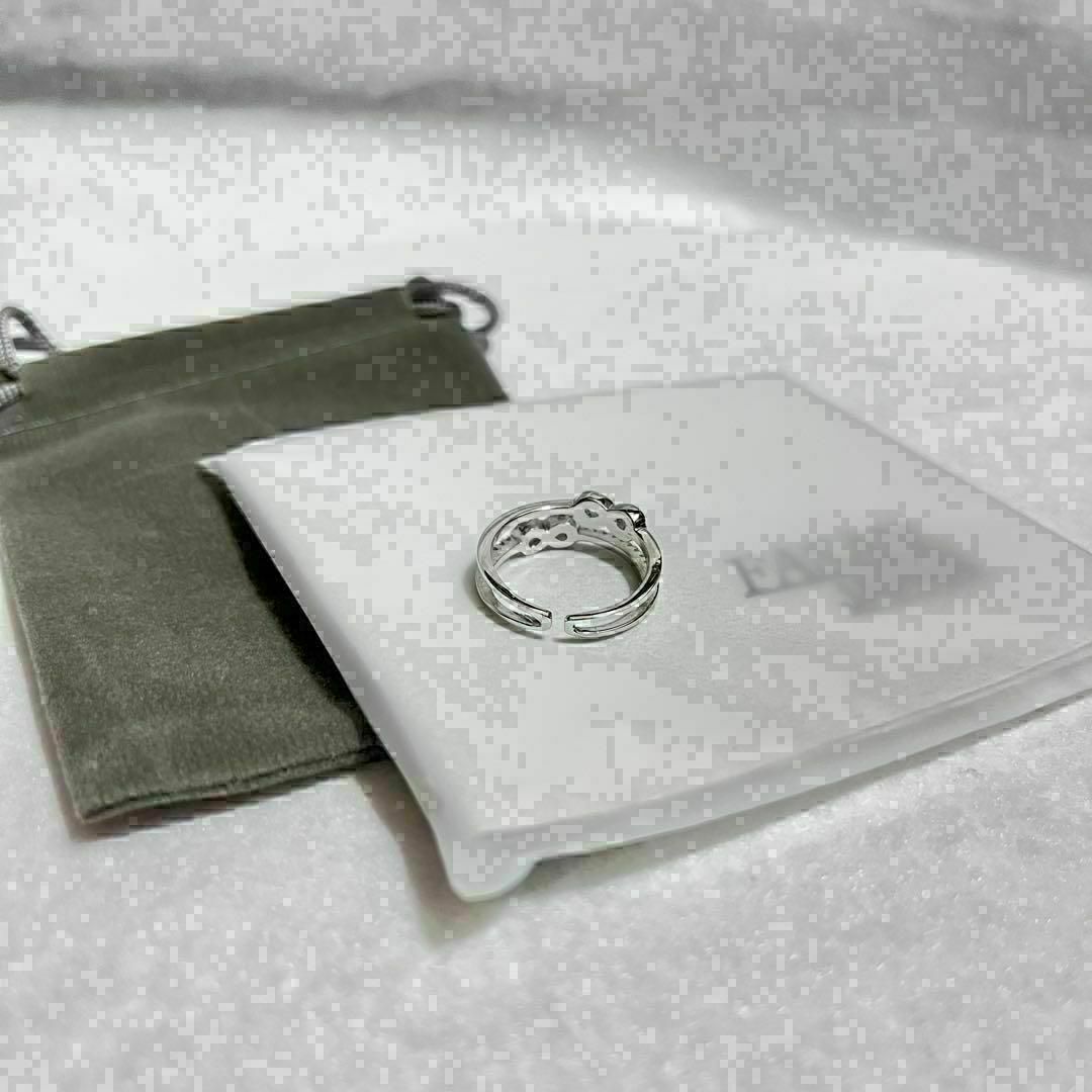 カレンシルバー　ダブルリング　指輪　リング　リボン　かわいい　シンプル　クロス レディースのアクセサリー(リング(指輪))の商品写真