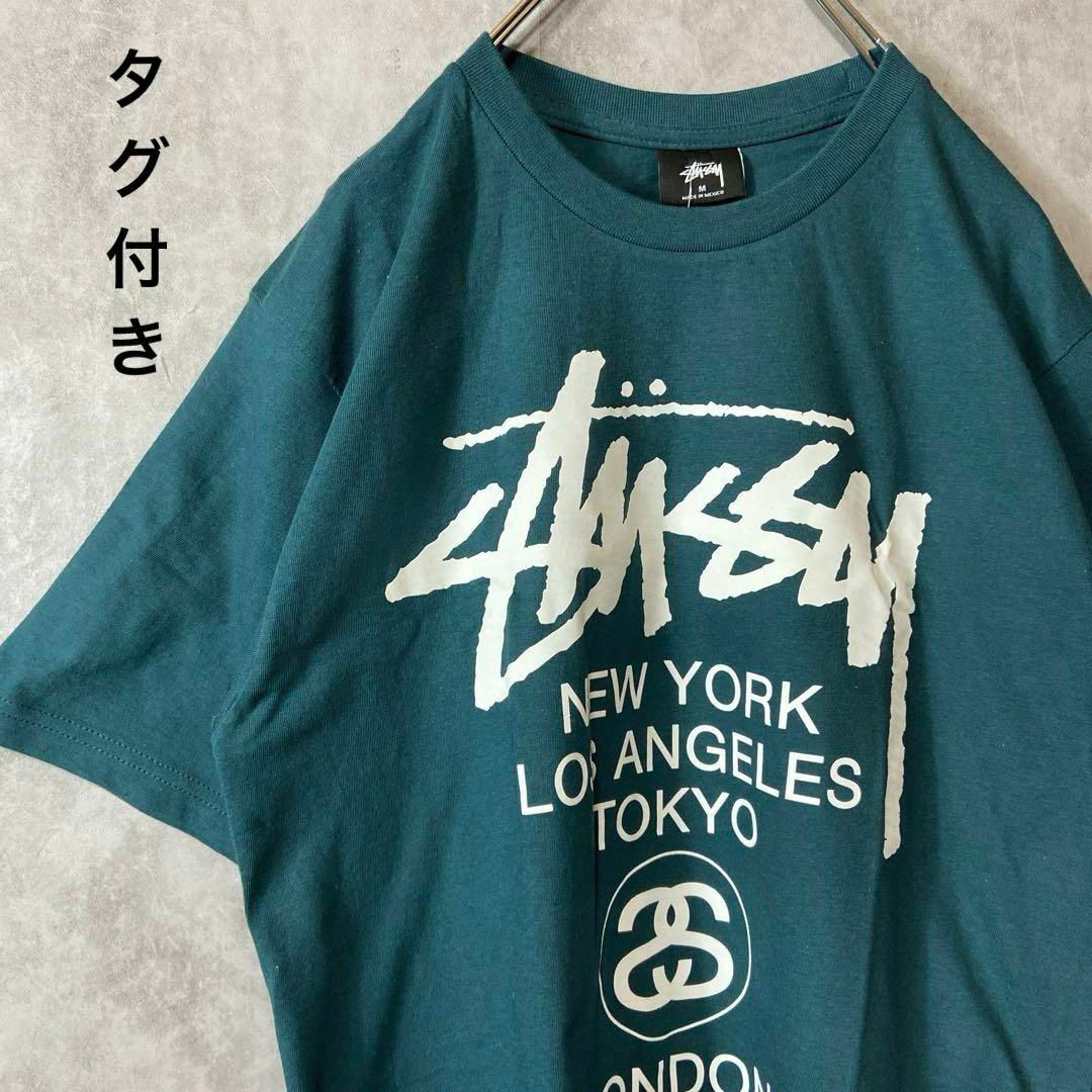 STUSSY(ステューシー)の【タグ付き、ワールドツアー】stussy両面プリントロゴTシャツ緑ストリートM メンズのトップス(Tシャツ/カットソー(半袖/袖なし))の商品写真