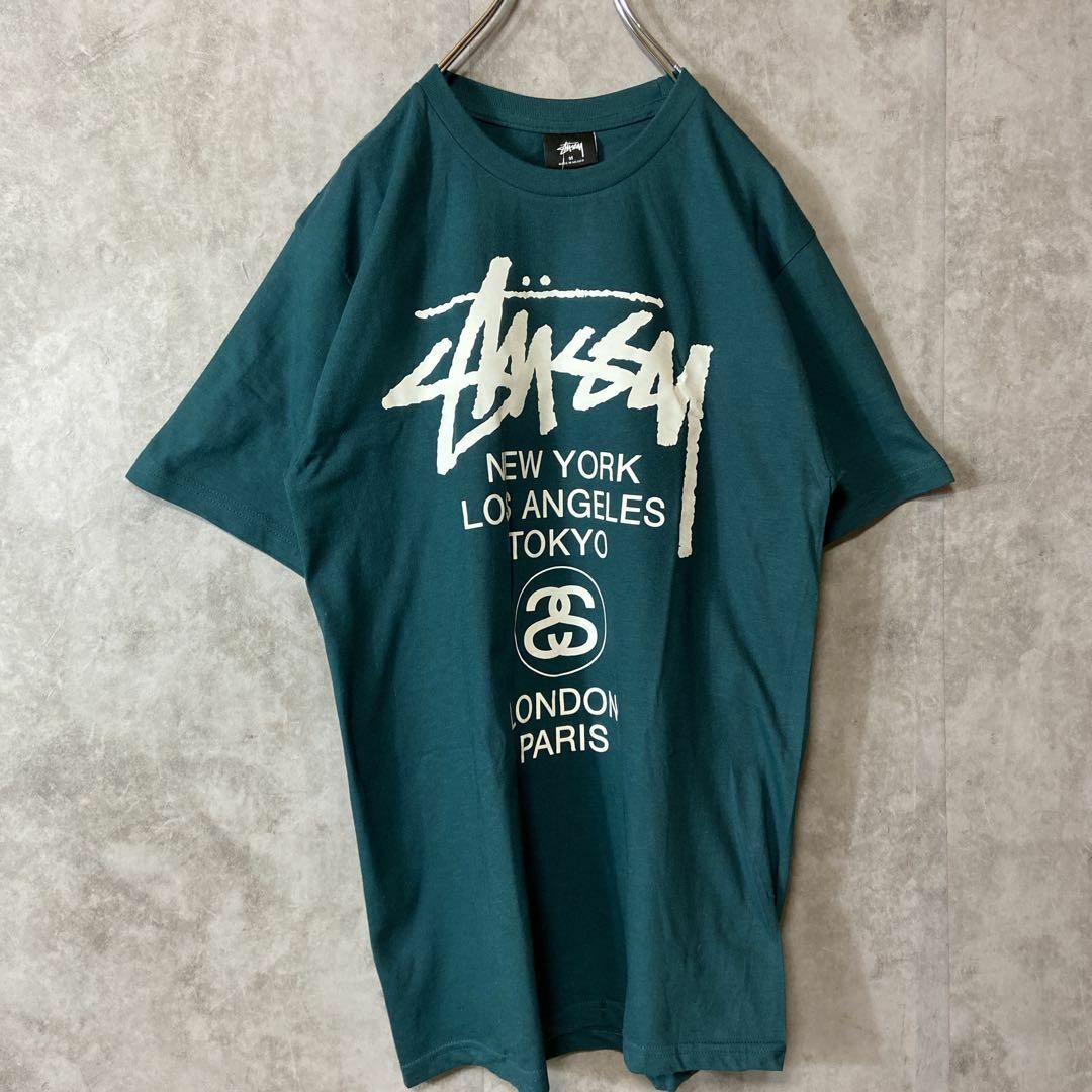 STUSSY(ステューシー)の【タグ付き、ワールドツアー】stussy両面プリントロゴTシャツ緑ストリートM メンズのトップス(Tシャツ/カットソー(半袖/袖なし))の商品写真